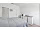 Simple bedroom with a comfortable bed and modern dresser at 3350 Mermoor Dr # 1201, Palm Harbor, FL 34685
