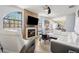 Inviting living room featuring a fireplace, large arched window, and modern furniture at 3350 Mermoor Dr # 1201, Palm Harbor, FL 34685