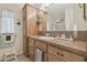 Bathroom featuring wood vanity, lots of storage, and decorative touches at 37545 Lilly Bea Ave, Zephyrhills, FL 33541