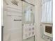 Bathroom shower with white fixtures and glass door, providing a clean and modern space at 37545 Lilly Bea Ave, Zephyrhills, FL 33541