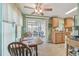 Breakfast nook with table and view to screened in porch at 37545 Lilly Bea Ave, Zephyrhills, FL 33541