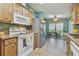 Well-lit kitchen area with matching appliances, and a breakfast nook at 37545 Lilly Bea Ave, Zephyrhills, FL 33541