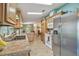 Kitchen with stainless steel appliances, sink and view into the living room at 37545 Lilly Bea Ave, Zephyrhills, FL 33541