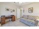 This living room features tile floors and a couch at 37545 Lilly Bea Ave, Zephyrhills, FL 33541
