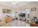 This living room features tile floors and large windows at 37545 Lilly Bea Ave, Zephyrhills, FL 33541