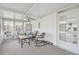 Screened porch featuring seating area with a fan and lots of light at 37545 Lilly Bea Ave, Zephyrhills, FL 33541