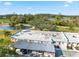 Aerial view of condos with covered parking, golf course and pond at 3829 Trophy Blvd, New Port Richey, FL 34655