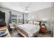 This bedroom features a ceiling fan, and neutral decor at 3829 Trophy Blvd, New Port Richey, FL 34655