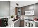 Cozy kitchen featuring modern appliances, granite counters, and functional layout for efficient meal preparation at 3829 Trophy Blvd, New Port Richey, FL 34655