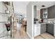 Inviting kitchen with modern appliances, stylish gray cabinets, and seamlessly connects to the dining and living areas at 3829 Trophy Blvd, New Port Richey, FL 34655