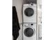 Modern, stacked white washer and dryer set in laundry area for convenience at 3829 Trophy Blvd, New Port Richey, FL 34655