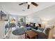 Comfortable living area with a fireplace, plush seating, and outdoor views at 3829 Trophy Blvd, New Port Richey, FL 34655