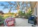 Inviting outdoor patio area with a variety of seating options and peaceful natural surroundings at 3829 Trophy Blvd, New Port Richey, FL 34655