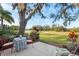 Inviting outdoor patio area with a variety of seating options and peaceful natural surroundings at 3829 Trophy Blvd, New Port Richey, FL 34655