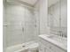 Modern bathroom featuring a glass-enclosed shower and marble vanity at 4012 W Morrison Ave, Tampa, FL 33629