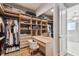 Large walk-in closet with vanity, mirror, shelving, and plenty of storage for clothing and accessories at 4012 W Morrison Ave, Tampa, FL 33629