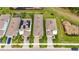 Aerial view of a single Gathering home including a neatly landscaped yard, surrounded by community at 407 Sandsend Ct, Apollo Beach, FL 33572