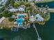 Community pool area with a large pool, docks, and palm trees at 407 Sandsend Ct, Apollo Beach, FL 33572