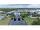 Stunning aerial view of a waterfront community featuring a canal and boat lift at 407 Sandsend Ct, Apollo Beach, FL 33572