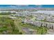 Beautiful aerial view of a single-Gathering home in a Primary-planned community with lake views at 407 Sandsend Ct, Apollo Beach, FL 33572