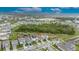 An aerial shot featuring a home, a lush conservation area, and community amenities at 407 Sandsend Ct, Apollo Beach, FL 33572