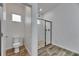 Modern bathroom featuring separate toilet room and tiled shower at 407 Sandsend Ct, Apollo Beach, FL 33572
