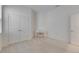 Bedroom with double doors, a side door, a desk with a chair and carpet flooring at 407 Sandsend Ct, Apollo Beach, FL 33572