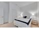 Bedroom with a large bed with matching side tables, lights, and a set of double doors at 407 Sandsend Ct, Apollo Beach, FL 33572