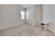 Bedroom with natural light, carpet, double doors, and a desk with a chair at 407 Sandsend Ct, Apollo Beach, FL 33572