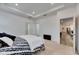 Bright bedroom features tray ceiling, neutral carpet, and white walls at 407 Sandsend Ct, Apollo Beach, FL 33572