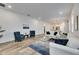 Modern living room featuring stylish decor, wood-look tile flooring, and an open layout at 407 Sandsend Ct, Apollo Beach, FL 33572