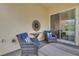 Relax on this covered patio featuring an outdoor seating area and open views at 407 Sandsend Ct, Apollo Beach, FL 33572