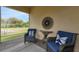 Cozy covered patio features comfortable seating and serene views of the landscaped backyard at 407 Sandsend Ct, Apollo Beach, FL 33572