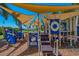 Colorful playground with shade structure and climbing features at 407 Sandsend Ct, Apollo Beach, FL 33572