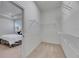 Walk-in closet with carpet flooring and wire shelving units at 407 Sandsend Ct, Apollo Beach, FL 33572