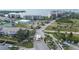 Aerial view of a waterfront community with tennis courts, condos, waterway and docks at 4650 Bay Blvd # 1012, Port Richey, FL 34668