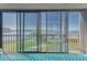 Screened-in lanai overlooking the inter-coastal waterway at 4650 Bay Blvd # 1012, Port Richey, FL 34668