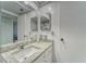 Bathroom with a vanity sink and mirror with flamingo patterned shower curtain partially visible at 4650 Bay Blvd # 1012, Port Richey, FL 34668