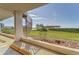 View from parking area of nearby community amenities overlooking water and lush landscaping at 4650 Bay Blvd # 1012, Port Richey, FL 34668