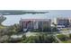Beautiful waterfront condo building with lush landscaping, covered parking and nearby amenities at 4650 Bay Blvd # 1012, Port Richey, FL 34668