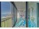 Relax in this lovely lanai overlooking waterfront views and featuring a bright, patterned outdoor rug at 4650 Bay Blvd # 1012, Port Richey, FL 34668