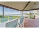 Covered patio with dining area overlooking the water, ideal for outdoor gatherings at 4650 Bay Blvd # 1012, Port Richey, FL 34668