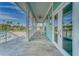 Inviting covered porch with outdoor seating and a view of the neighborhood at 4650 Bay Blvd # 1012, Port Richey, FL 34668