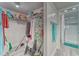 View of the walk-in closet and bathroom with a glass enclosed shower at 4650 Bay Blvd # 1012, Port Richey, FL 34668