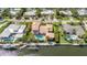 This aerial shot showcases a home with a private pool and dock, providing convenient waterfront living at 520 74Th St, Holmes Beach, FL 34217