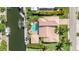 Stunning aerial view of the waterfront home with a private pool and boat dock access at 520 74Th St, Holmes Beach, FL 34217