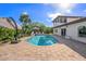 This backyard shows a private pool and patio area in a tropical setting perfect for relaxation and entertaining at 520 74Th St, Holmes Beach, FL 34217