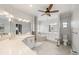 Bright bathroom with dual vanities, a soaking tub, and stylish tile flooring at 520 74Th St, Holmes Beach, FL 34217