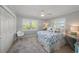Cozy bedroom with plantation shutters and blue and white accents at 520 74Th St, Holmes Beach, FL 34217