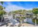 This image shows a dock with a boat lift, allowing for the easy raising and lowering of a boat into the water at 520 74Th St, Holmes Beach, FL 34217